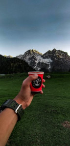 In the embrace of mountains, coffee becomes a symphony for the senses. There's something magical about the way a simple cup of coffee can enhance our connection to the world around us. As I hold this warm mug in front of these majestic peaks, I'm reminded of the beauty and vastness that lies both within and beyond myself. Let the aroma awaken your senses, let the mountain air invigorate your spirit, and let that first sip transport you to a realm of pure bliss. Embrace the moment and let nature's wonders dance with the perfect cup of coffee in your hands.